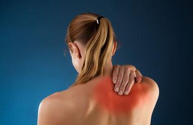 Back pain in a woman's shoulder blades